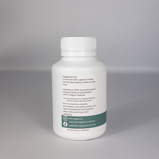 White supplement bottle with a label on a gray background